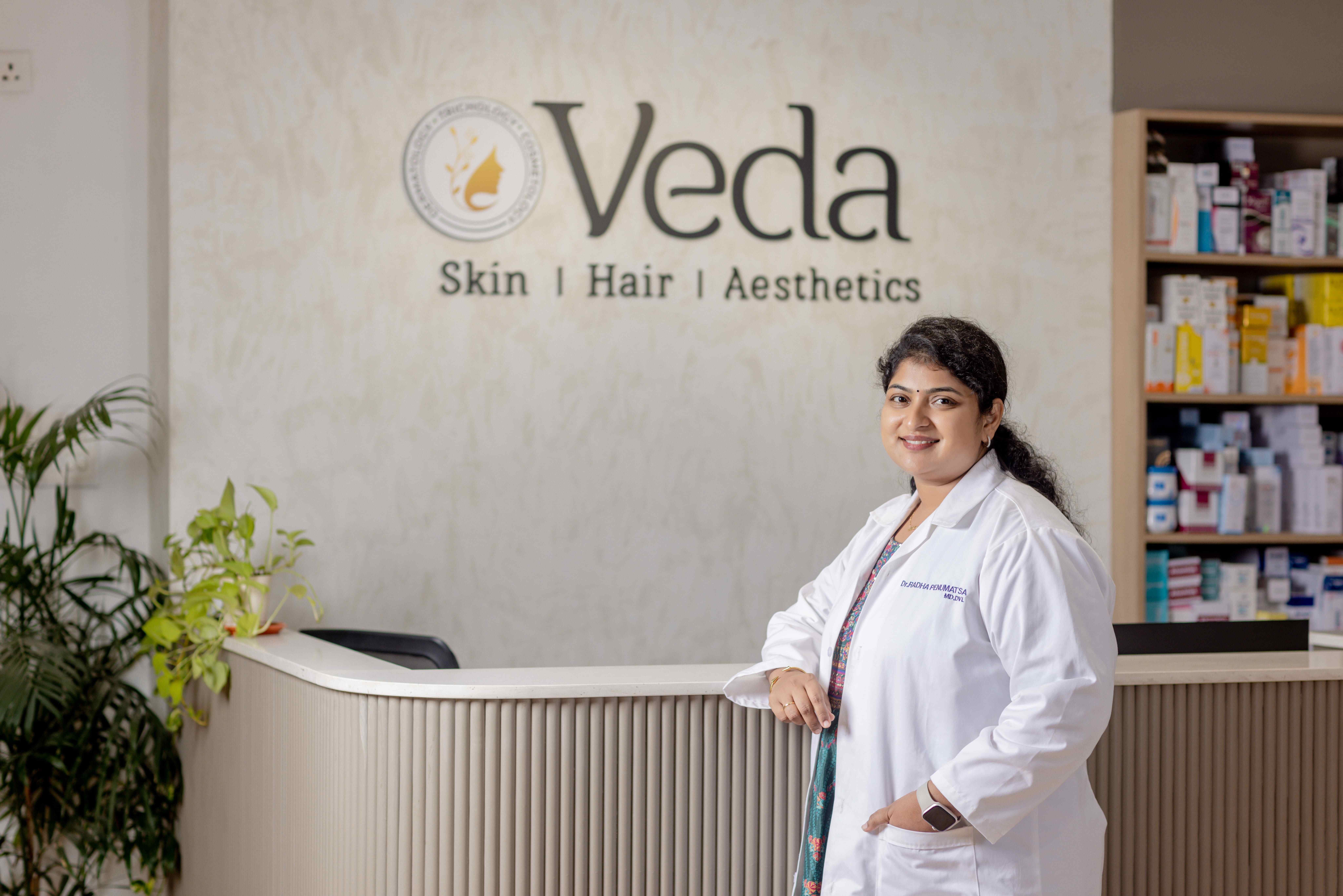 a picture of Dr.Radha Penumatsa standing in reception area